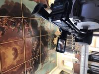 Video camera equipment in a room with high painted ceiling