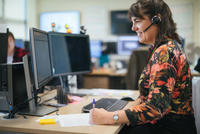 IT support person sitting at a computer